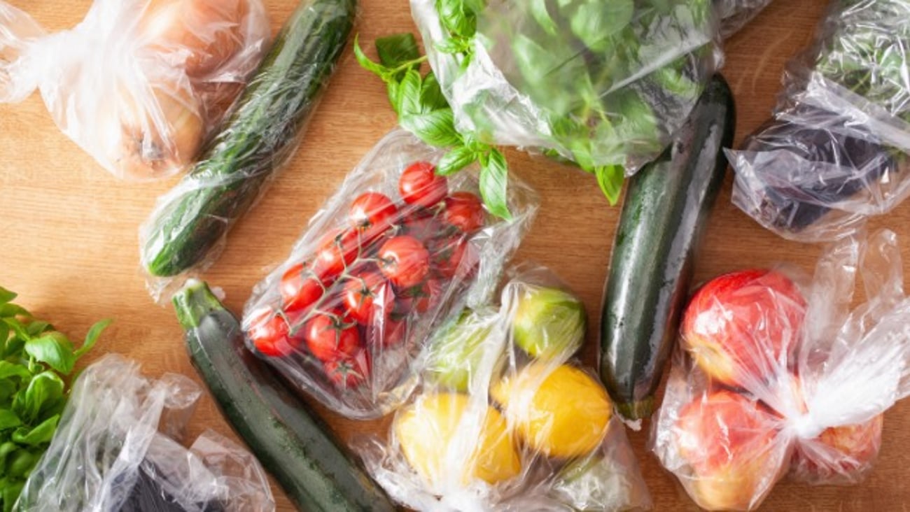 single use plastic waste issue. fruits and vegetables in plastic bags