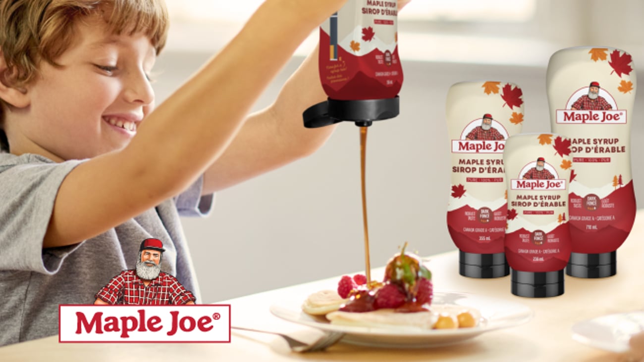Kid squeezing a Maple Joe® Maple Syrup Squeeze bottle