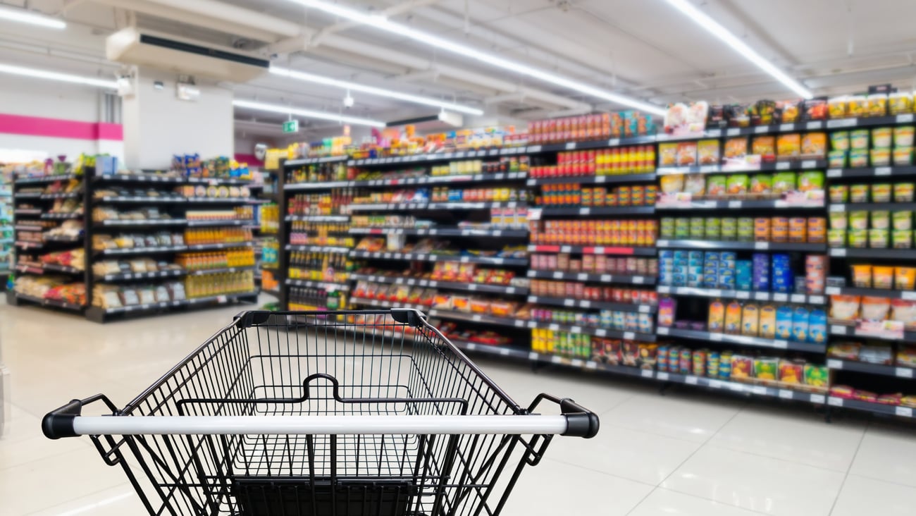 grocery cart in a store blurred shelves