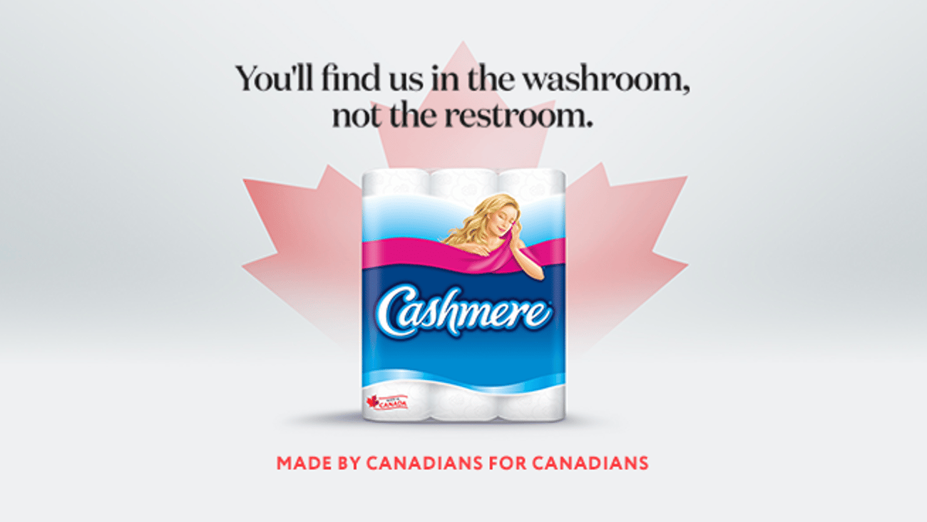 A pack of Cashmere bathroom tissue against a red maple leaf