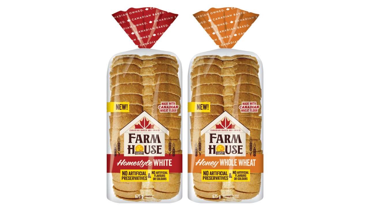 Two packaged loaves of FARMHOUSE BY COUNTRY HARVEST sliced bread