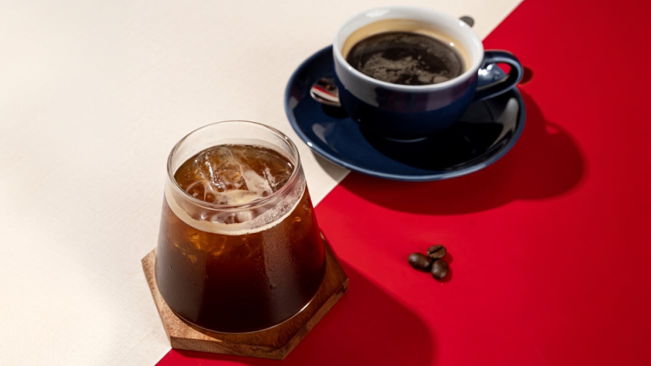 A cup of hot coffee and iced coffee