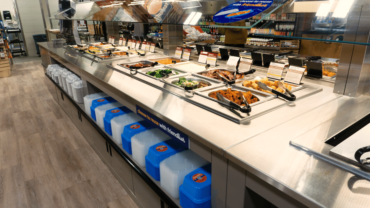 Hot and salad bar at Farm Boy with Friendlier reusable containers and lids underneath.
