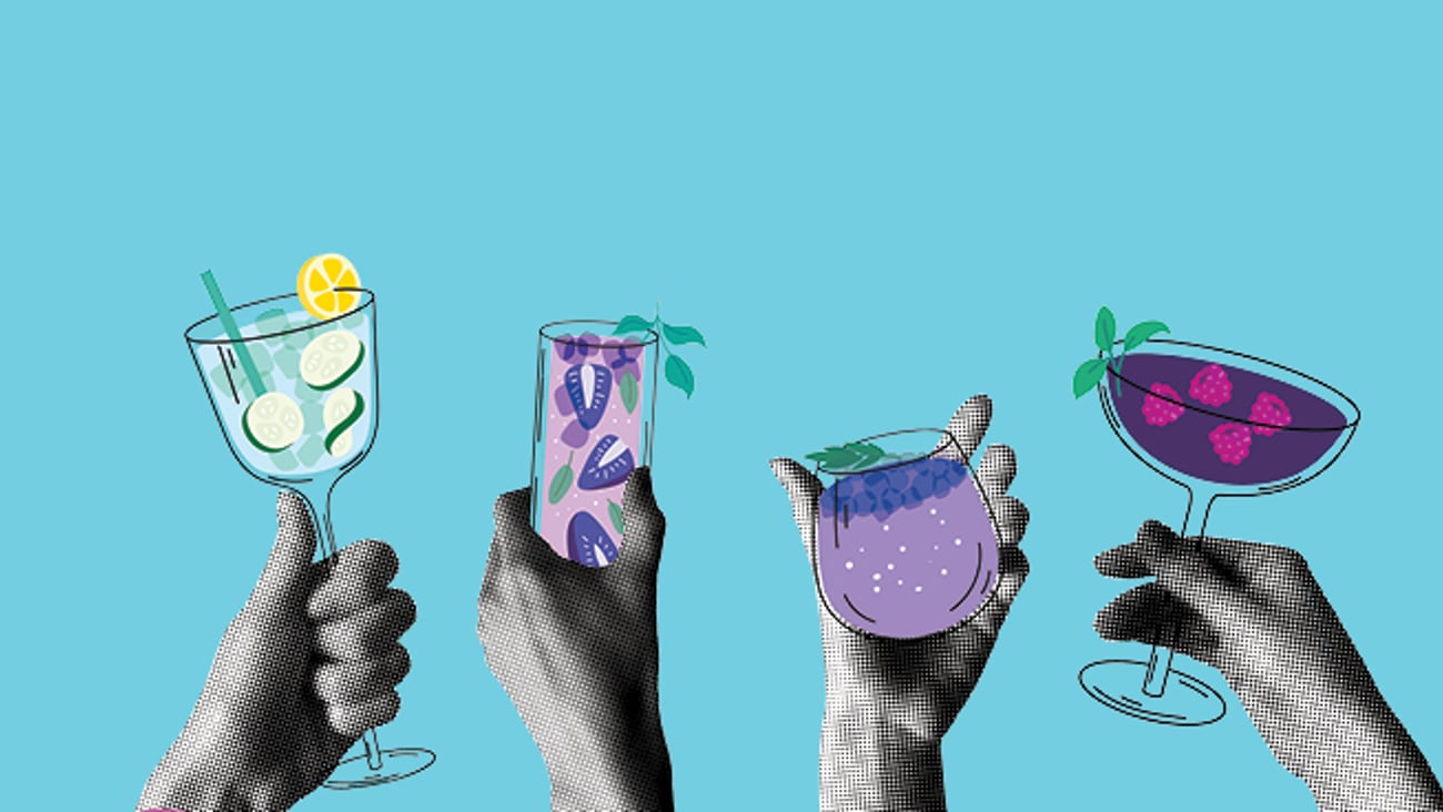 Hands holding glasses of non-alcoholic beverages against a blue background