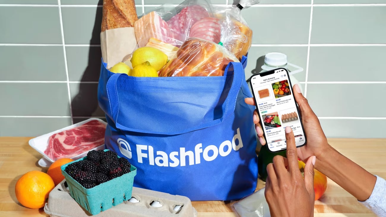 A Flashfood-branded reusable bag overflowing with groceries