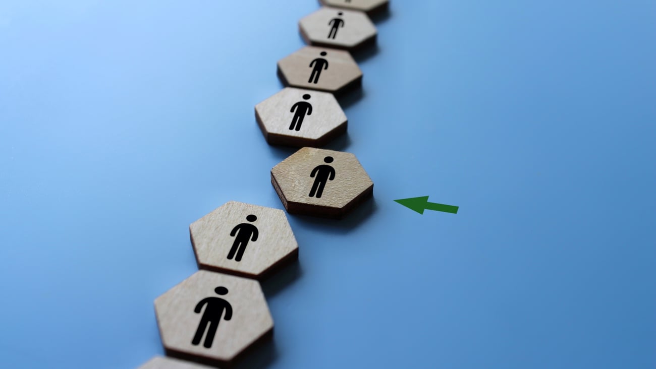 Wooden blocks with people icon join the team. New member, hiring, fill a vacancy concept