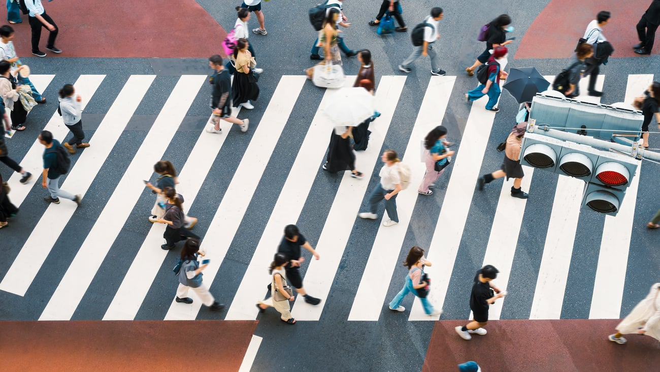 people crossing a busy street