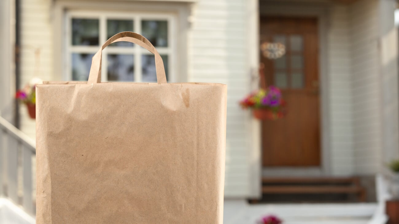Home delivery of food grocery bag left at door; Shutterstock ID 1775429165