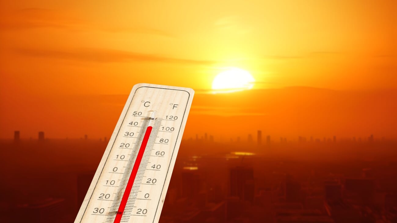 A thermometer and heat wave in a big city; Shutterstock ID 2316040845