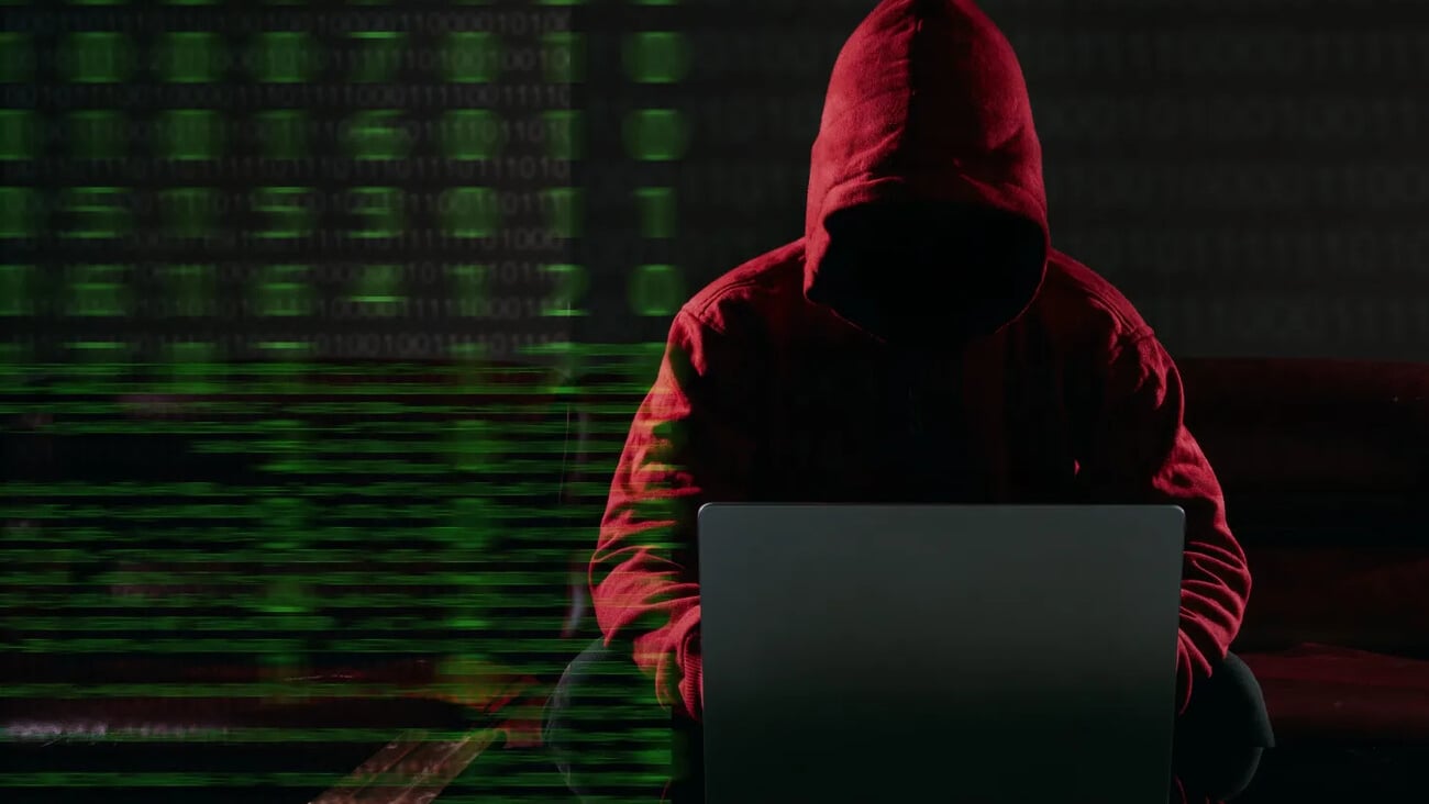 Hacking and malware concept. Hacker using laptop computer with binary code digital interface. Double exposure.; Shutterstock ID 2568514305
