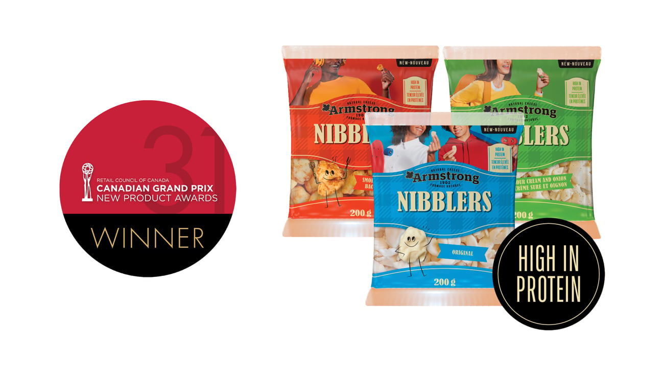 Three packs of Armstrong Nibblers Natural Cheese Snacks next to the Grand Prix logo