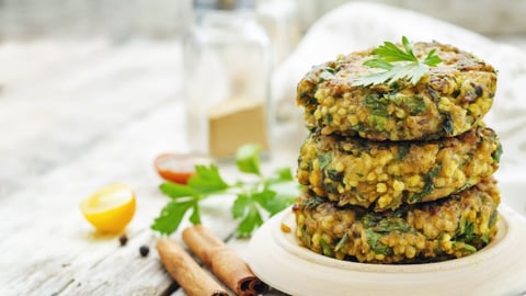 spicy vegan curry burgers with millet, chickpeas and herbs