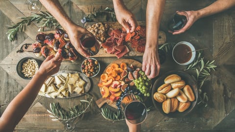 A wooden table filled with holiday dishes