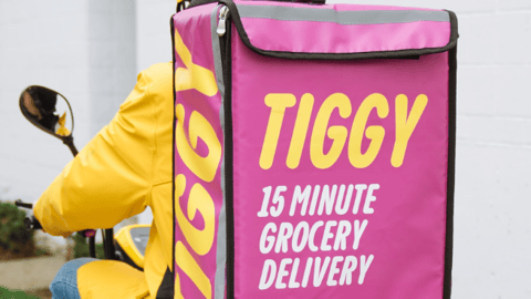 Tiggy delivery person on a motorized bike