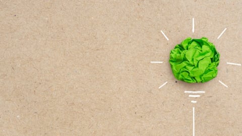 Green crumpled paper light bulb, Corporate Social Responsibility (CSR), eco-friendly business and environmental concept with copy space