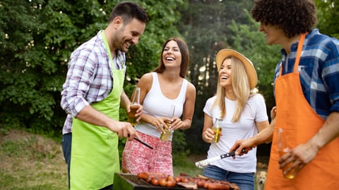 Group of happy young friends having barbecue party, outdoors