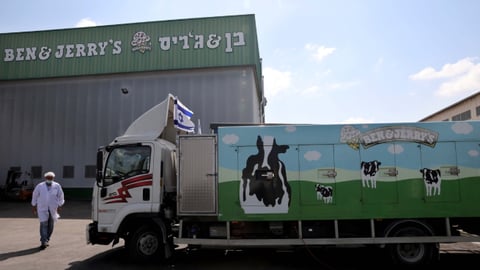 Teaser A Ben Jerry's ice-cream delivery truck is seen at their factory in Be'er Tuvia near Israeli southern city of Kiryat Malakhi on July 21, 2021