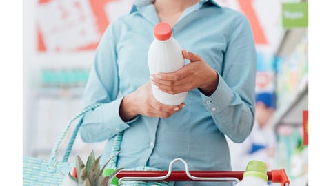 woman holding plant-based milk