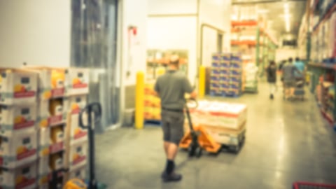 worker in cold storage room of warehouse