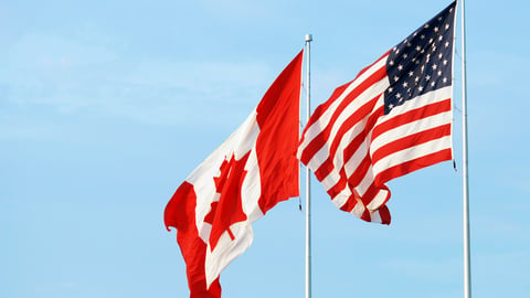 canadian and US flags at the border