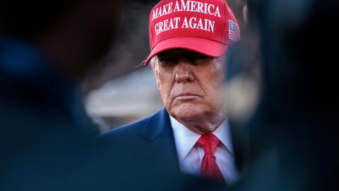 donald trump wearing a maga hat