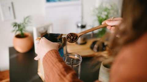 woman making coffee at home