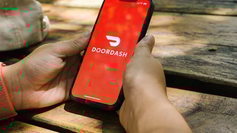 someone using doordash on their mobile phone