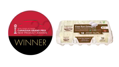 A carton Free Run Omega-3 + Lutein Eggs next to the Grand Prix winners logo