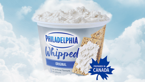 A tub of Philadelphia Whipped Cream Cheese sitting on a cloud