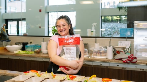 A young girl doing meal prep in a service kitchen