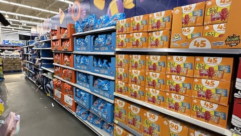 Halloween candy displays in a grocery store aisle 