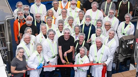 Lassonde team at a ribbon cutting for its new production line