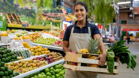 Grocery worker in the produce section