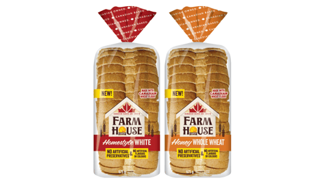 Two packaged loaves of FARMHOUSE BY COUNTRY HARVEST sliced bread