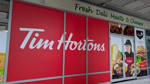 Exterior shot of a Tim Hortons signs on a Rabba store