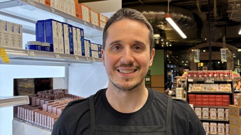 Nathan Alvarez stands in a Whole Foods store