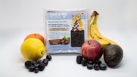 A pack of Sher Squares surrounded by fruit