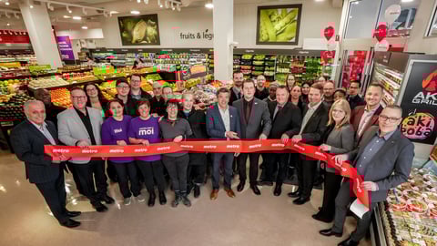 Metro Plus employees cutting a ribbon at the store opening in Montreal