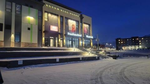 Exterior shot of Inuulisautinut Niuvirvik grocery store at night