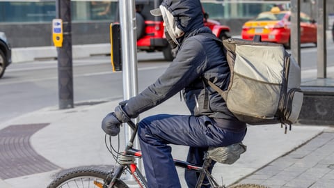  A food delivery courier on an bicycle in Toronto.