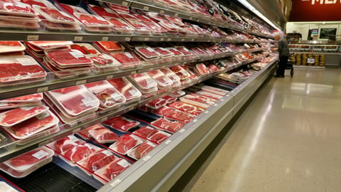 Person buying meat at a grocery store in Canada