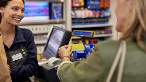 grocery store worker friendly interaction with paying customer