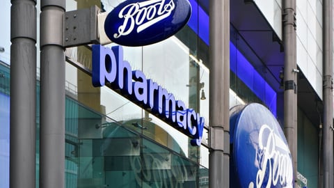 Typical blue oval sign at one of many Boots branches in London. Boots is a health and beauty pharmacy chain in UK and few other countries