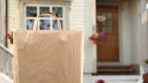 Home delivery of food grocery bag left at door; Shutterstock ID 1775429165