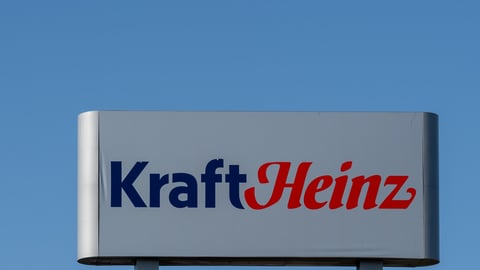 Mount-Royal, Montreal, QC, Canada - September 4, 2021: Kraft Heinz sign with blue sky in background at their plant in Montreal, QC, Canada. Kraft Heinz is an American food company. ; Shutterstock ID 2047283078