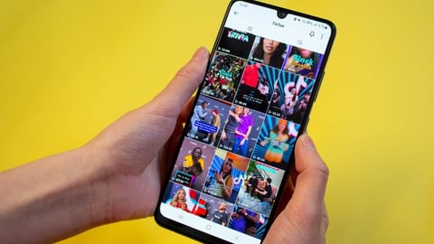 Woman surfing on TikTok. Popular social media app TikTok. Afyonkarahisar, Turkey - February 18, 2023.; Shutterstock ID 2264539907
