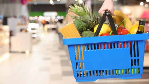 Customer holding shopping basket with different food products at supermarket, closeup. Banner design; Shutterstock ID 2704474369