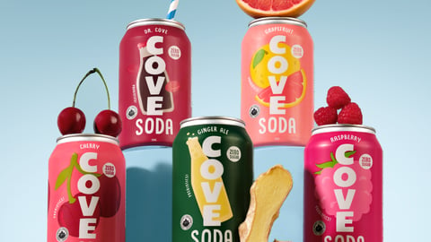 Can of Cove Soda's new flavours against a blue background