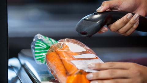 scanning barcode on bag of carrots