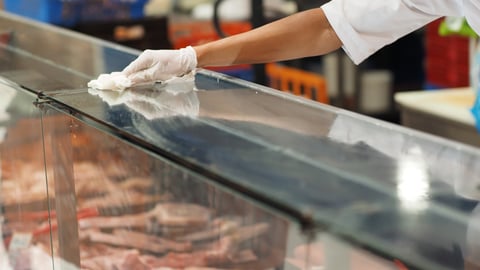 worker cleaning a grocery store